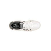 White sneaker with black sole on a white background