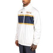 Male model wearing Arapi Modelo Jacket in white. Side view.