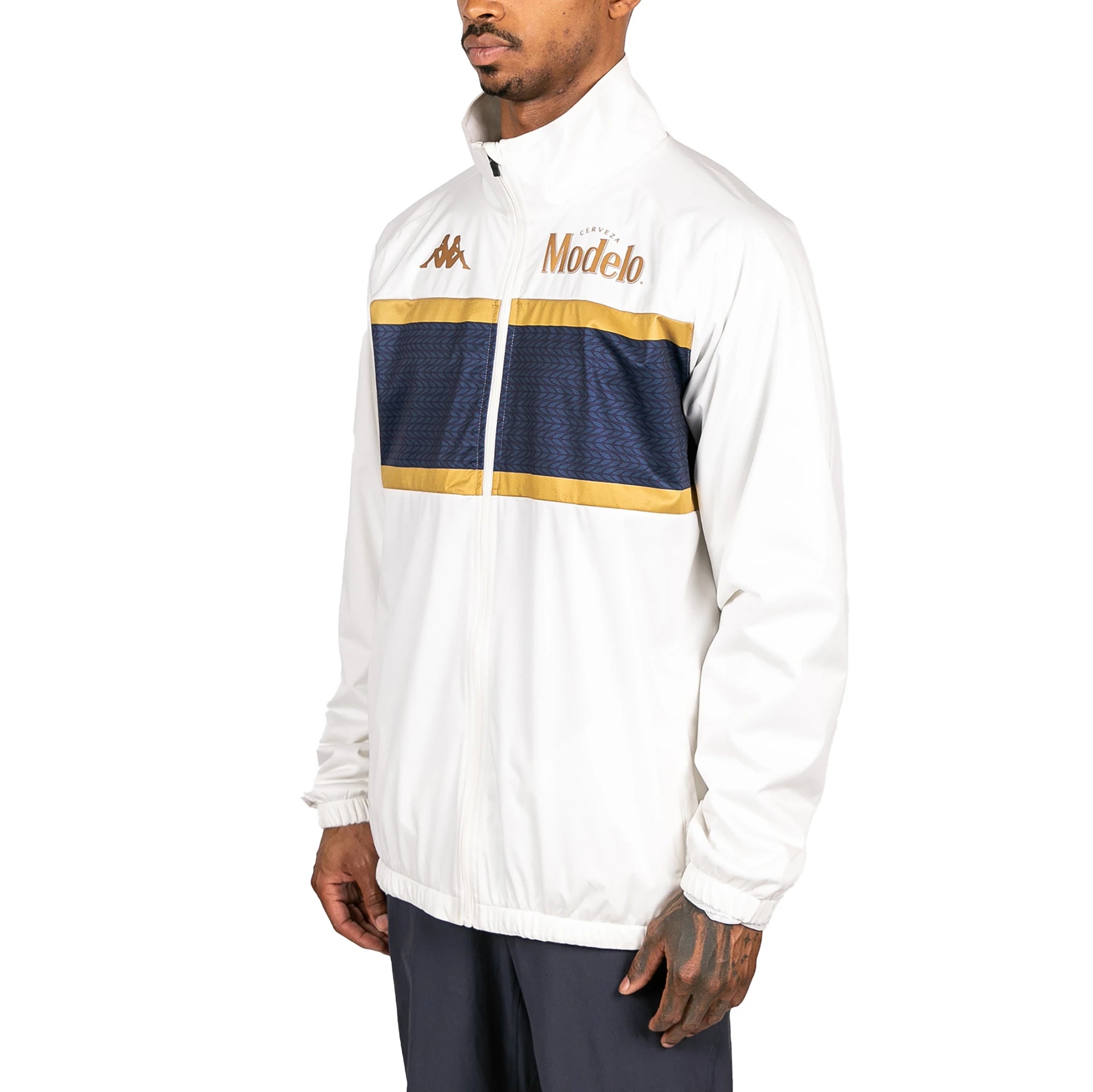 Male model wearing Arapi Modelo Jacket in white. Side view.