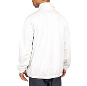 Male model wearing Arapi Modelo Jacket in white. Back view.