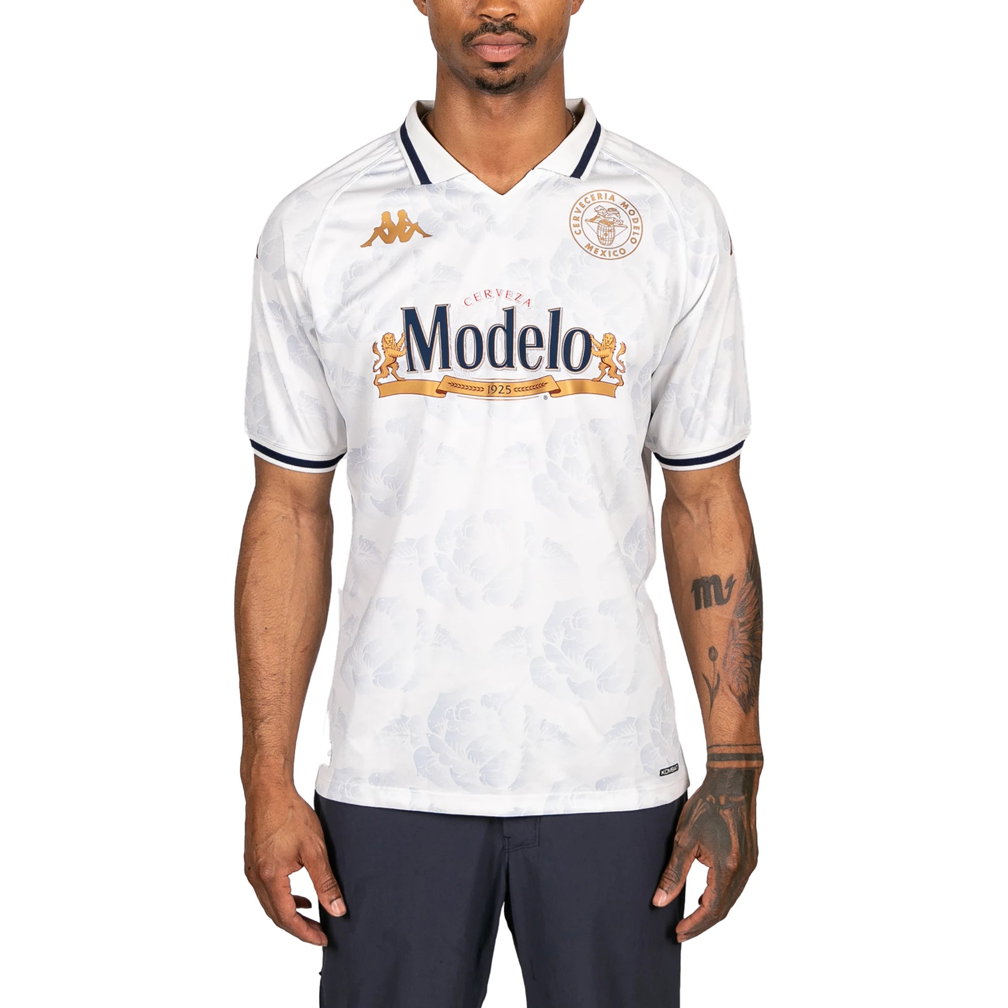 Male model wearing Kombat 2025 Modelo Soccer Jersey in white. Front view.