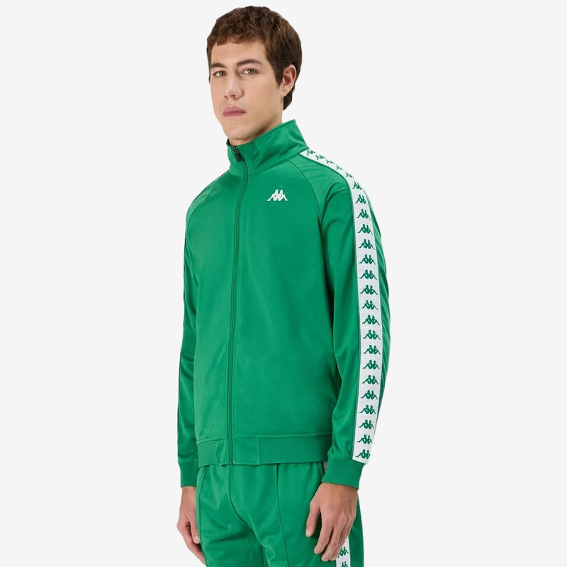 #color_green
Man wearing green Kappa track jacket with white and green banda going down the arms and Omini logo in white on left side. Front view.