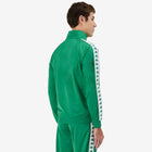 #color_green
Man wearing green Kappa track jacket with white and green banda going down the arms and Omini logo in white on left side. Back view.