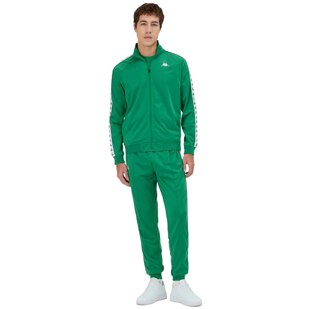 Man wearing green Kappa track jacket with white and green banda going down the arms and Omini logo in white on left side. Full body view.