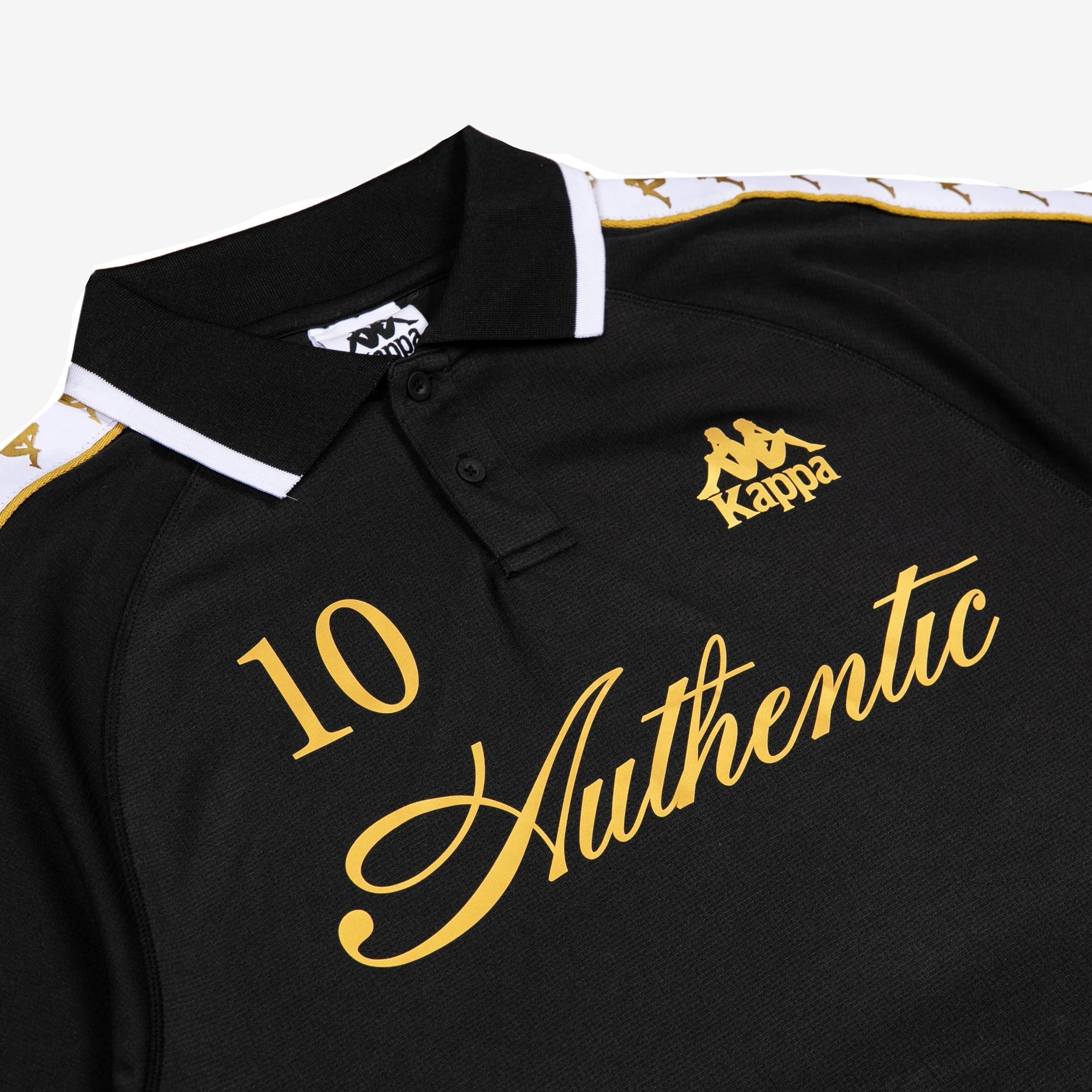 Black polo with white banda down the tops of each sleeve. Front reads Authentic, the number 10, and the Kappa logo in golden yellow.