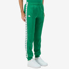 Man wearing Green Kappa track pants featuring Kappa Banda on side of legs in white and green. White Omini logo on right leg. Front side view.