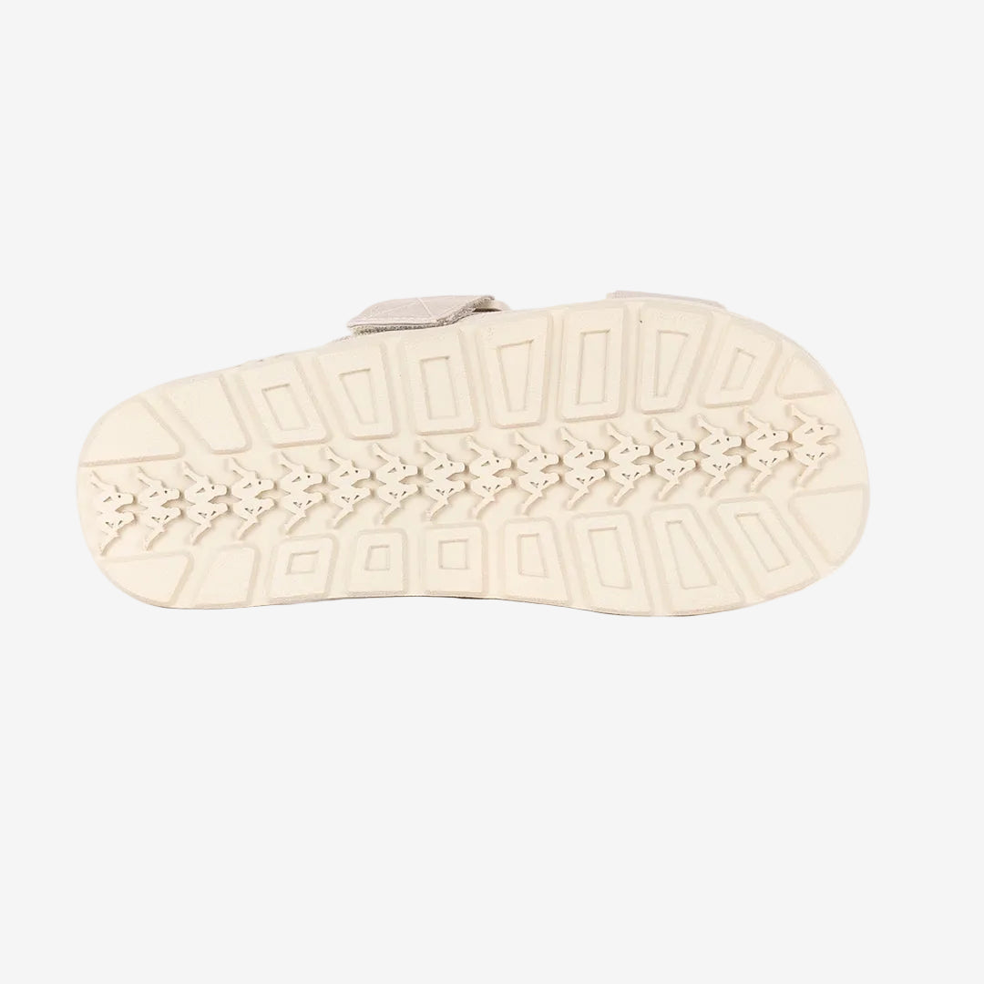 Beige sandal sole with textured pattern on a white background