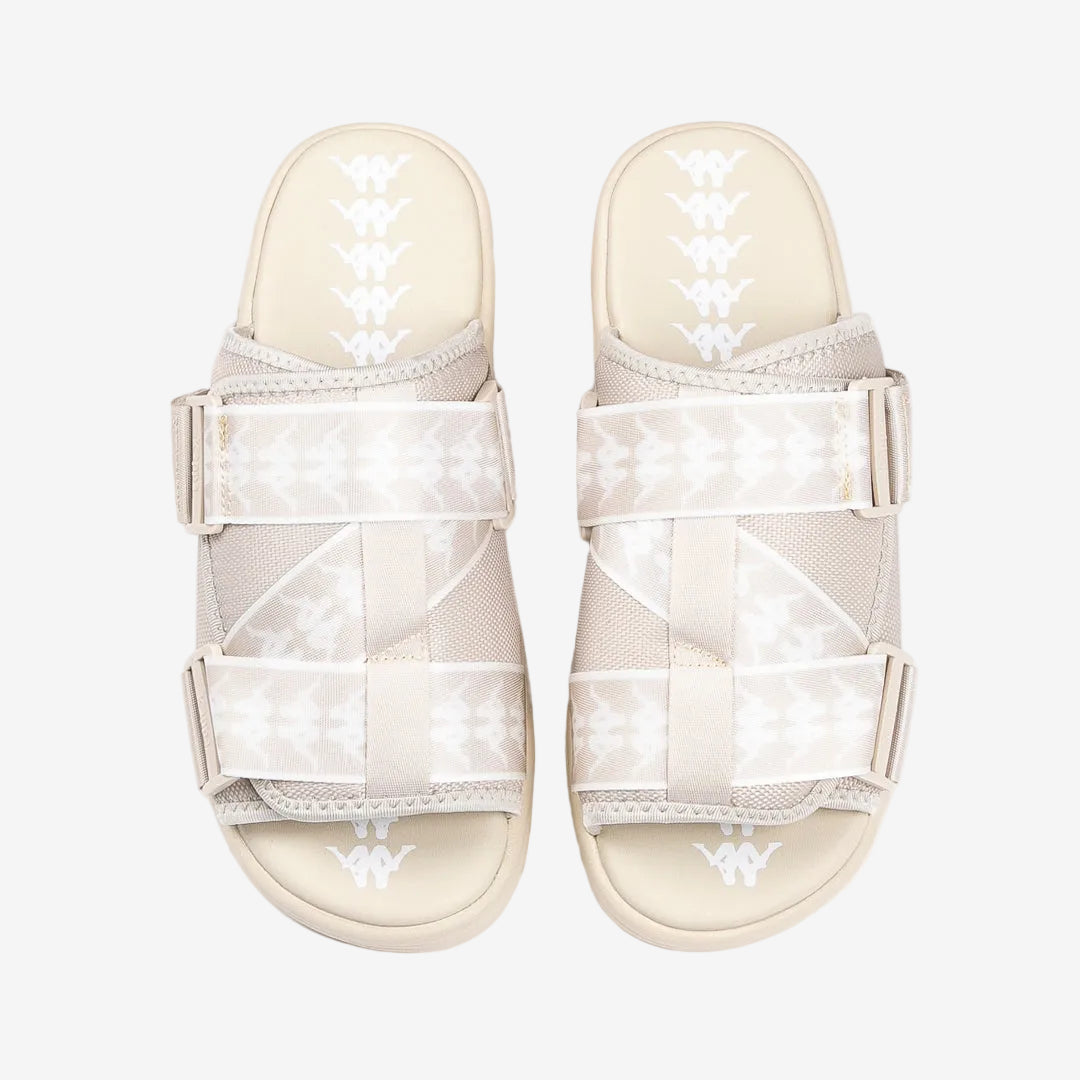 Beige sandals with mesh design on a white background