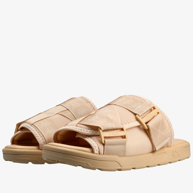 Beige sandals with woven straps on a white background