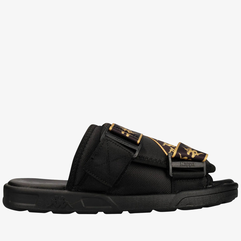 A single black Kappa slide sandal with gold and black patterned straps, shown in a side profile on a white background.
