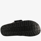 Black sandal sole with tread pattern on a white background
