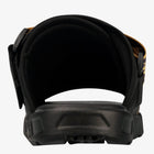 Close-up rear view of a black athletic sandal with a thick cushioned arch support and textured sole, shown on a white background.