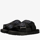 A pair of black Kappa slide sandals with gray and black logo-patterned straps, shown on a clean white background.