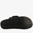 Black sandal sole with textured pattern on a white background