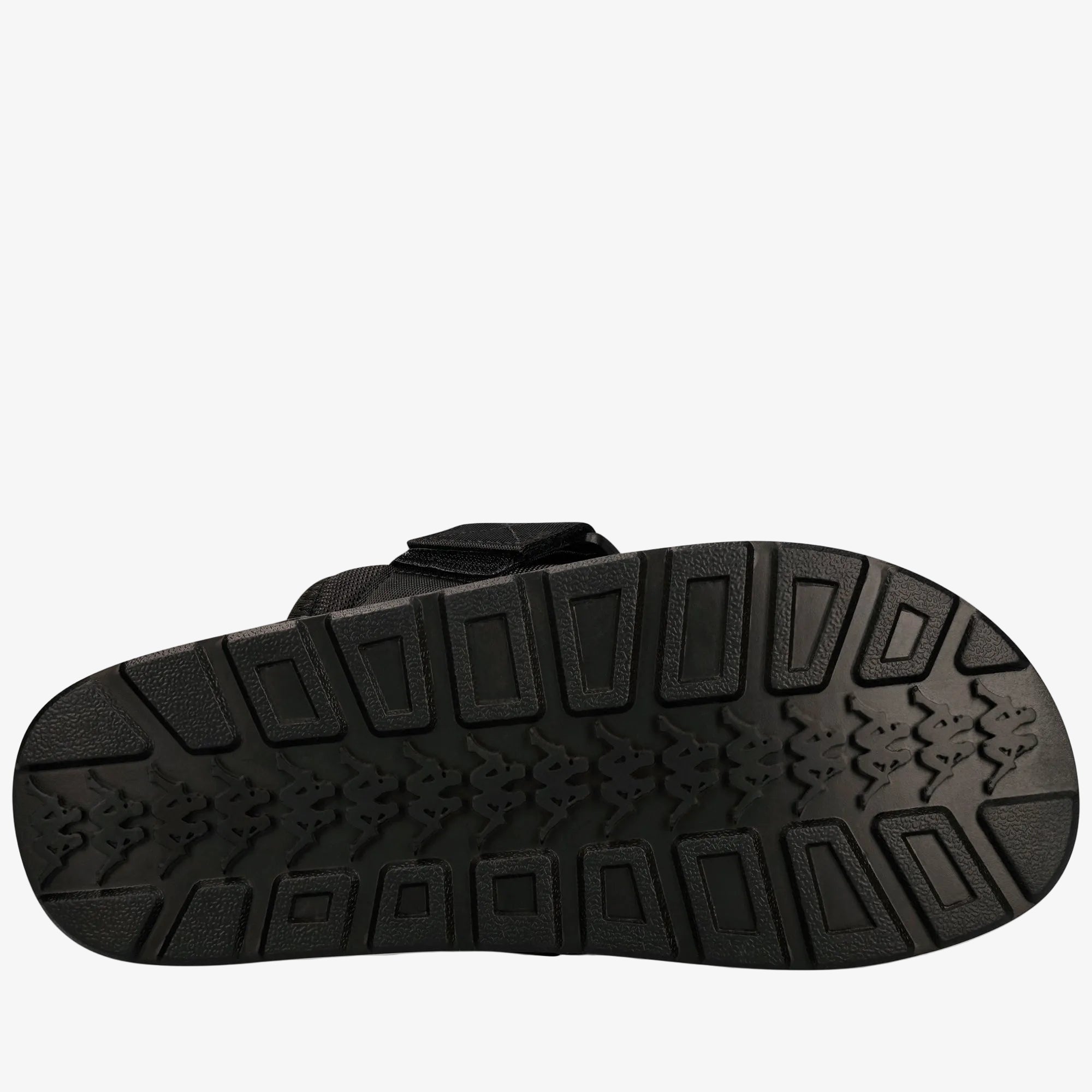 Black sandal sole with textured pattern on a white background
