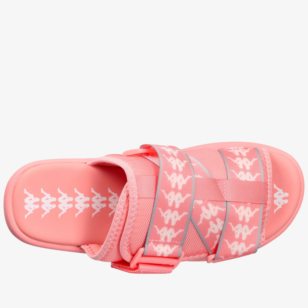 A coral pink slide sandal featuring a woven upper with white Kappa logos and gray piping, shown from a side profile on a white background.