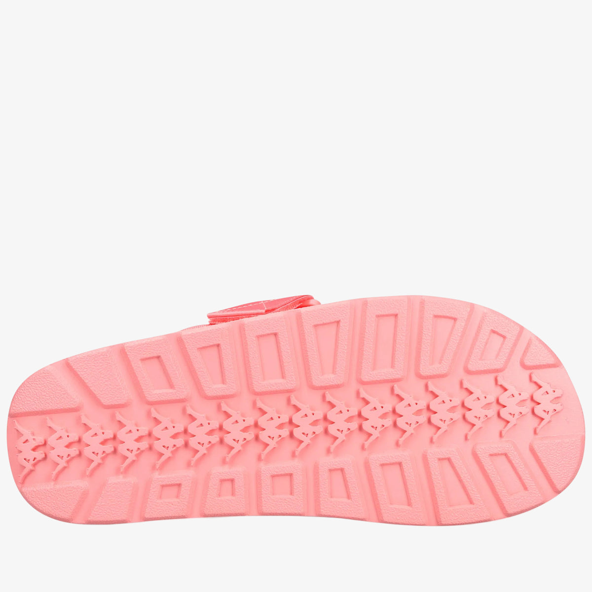 A single pink slip-on sandal shown from the sole view, featuring a textured tread pattern and a small matching pink strap at the top, isolated on a white background.