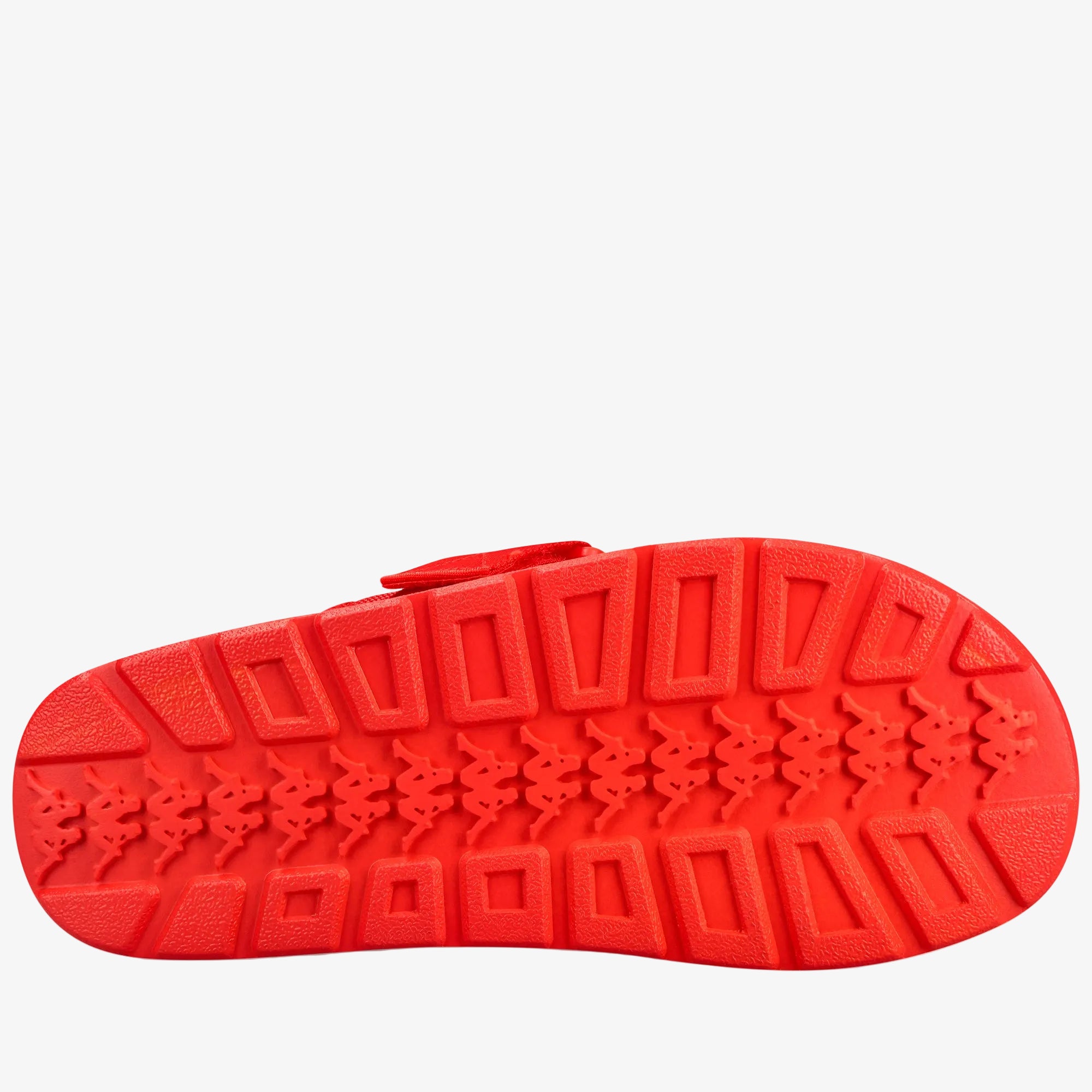 A bright red shoe sole with a textured tread pattern and repeating K-Swiss logo motifs, shown against a plain white background.