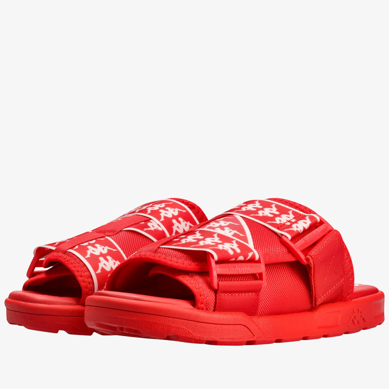 A pair of red slide sandals with white Kappa logo straps, shown against a plain white background.