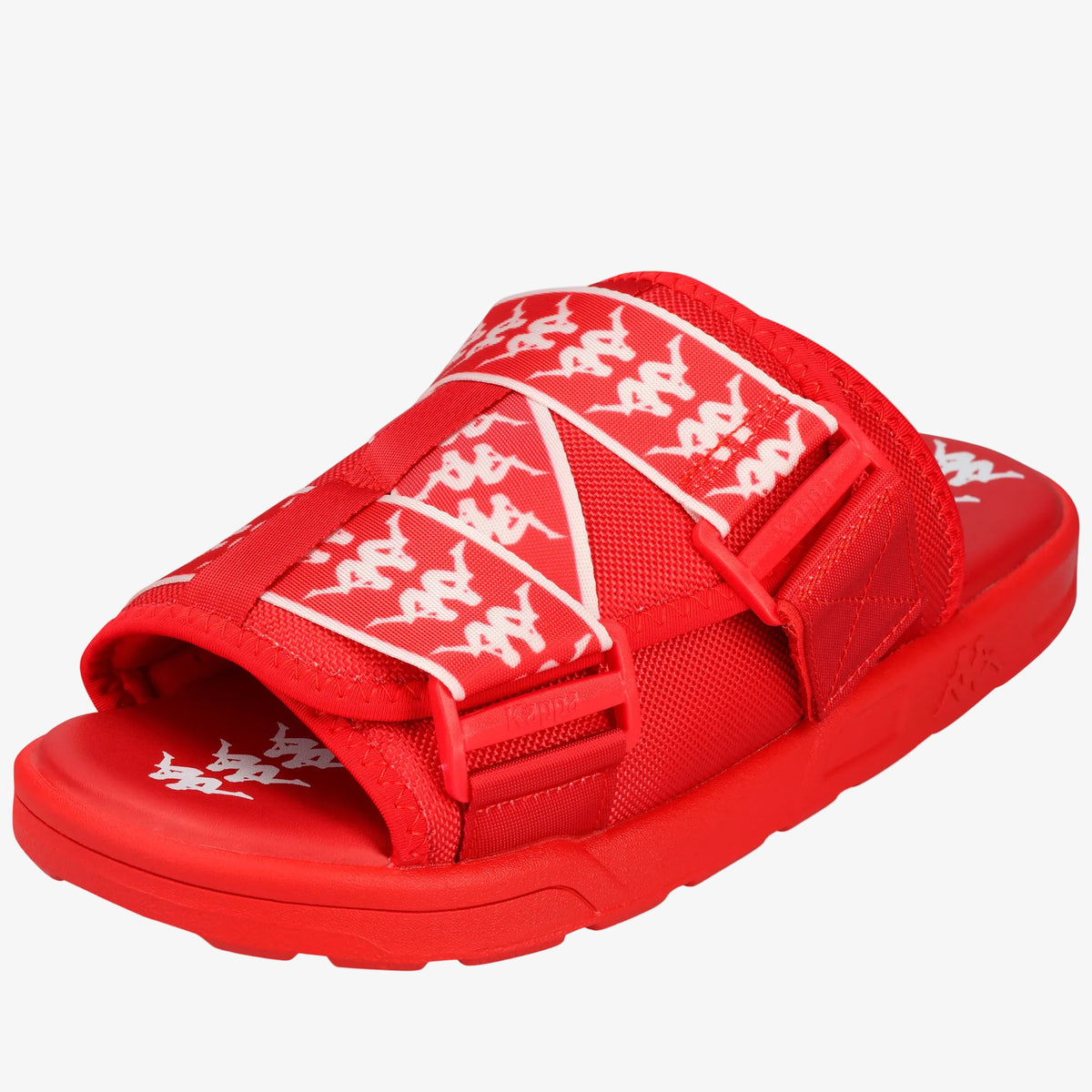 A red slide sandal with white printed graphics of stylized figures on the straps, shown from a three-quarters angle on a white background.
