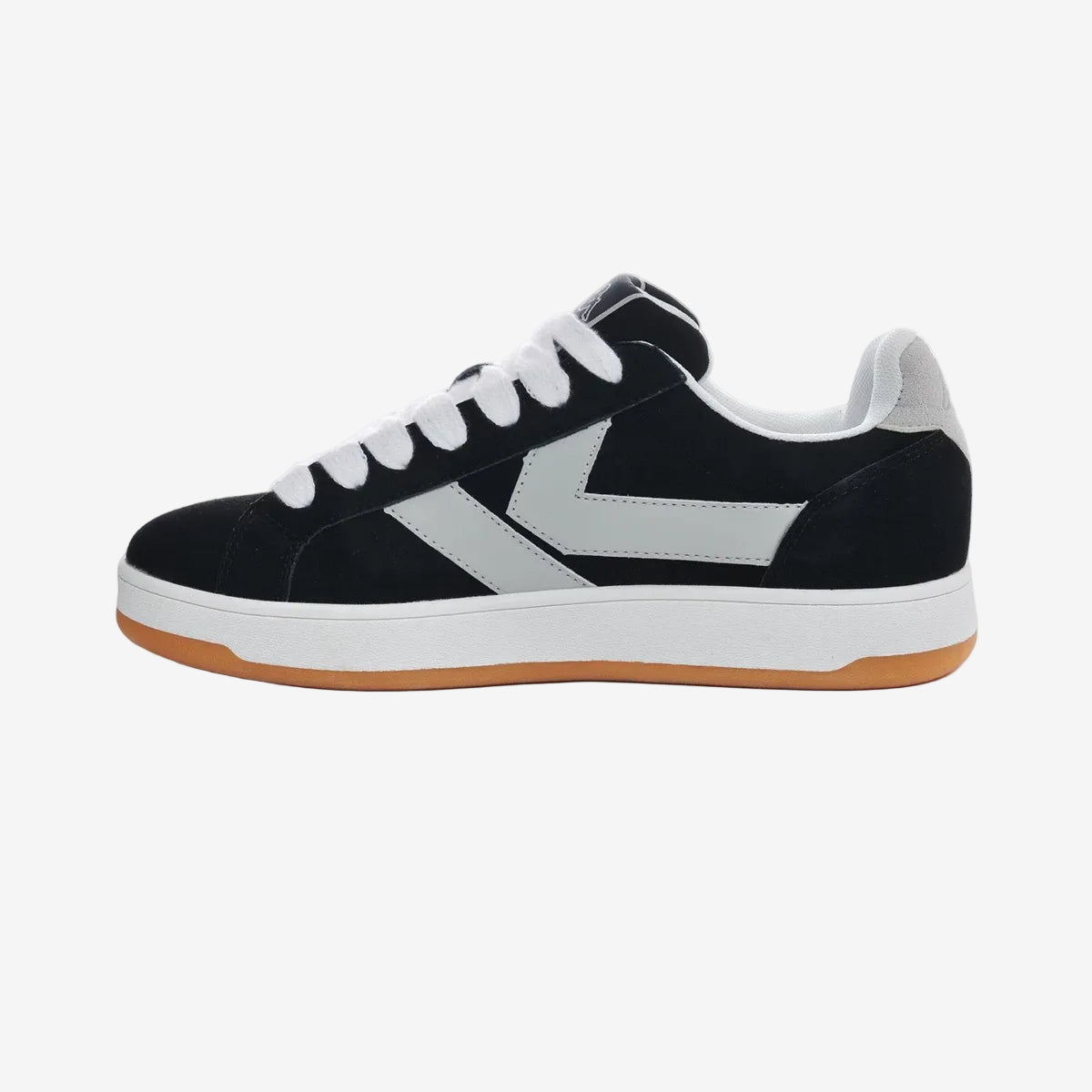 Black and white sneaker with gum sole on a white background