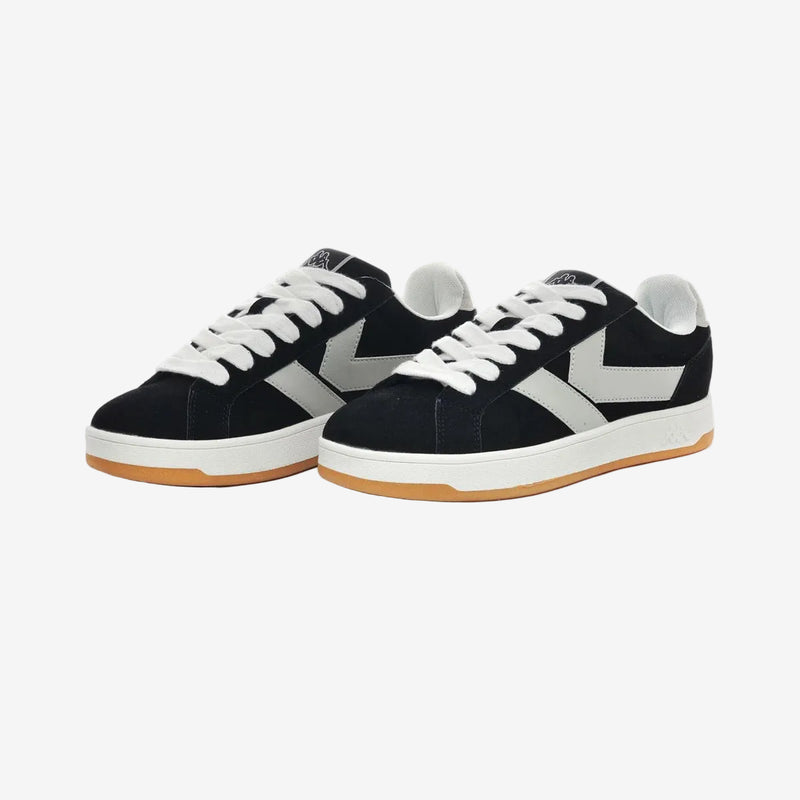 Black and white sneakers with gum sole on a white background