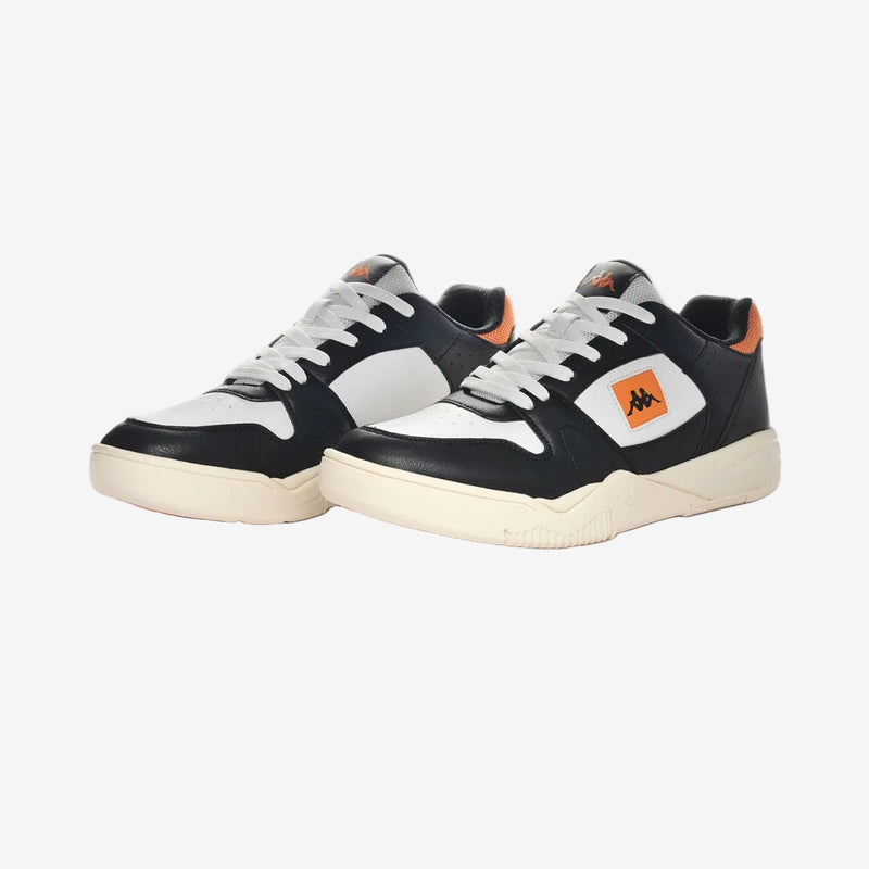 Black and white sneakers with orange accents on a white background