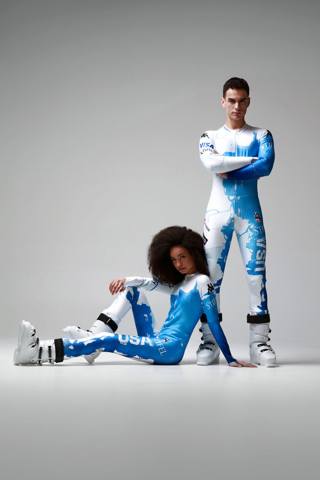 Male and female model posing in kappa Protect Our Winter Collaboration Ski Suits.