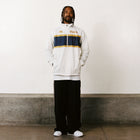 Male model wearing Arapi Modelo Jacket in white. Front view.