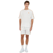 White shorts featuring Kappa Banda on the sides with green and orange omini logos. Full body view on model.