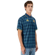 Man wearing Kappa Authentic Nekoda Polo. Side view.