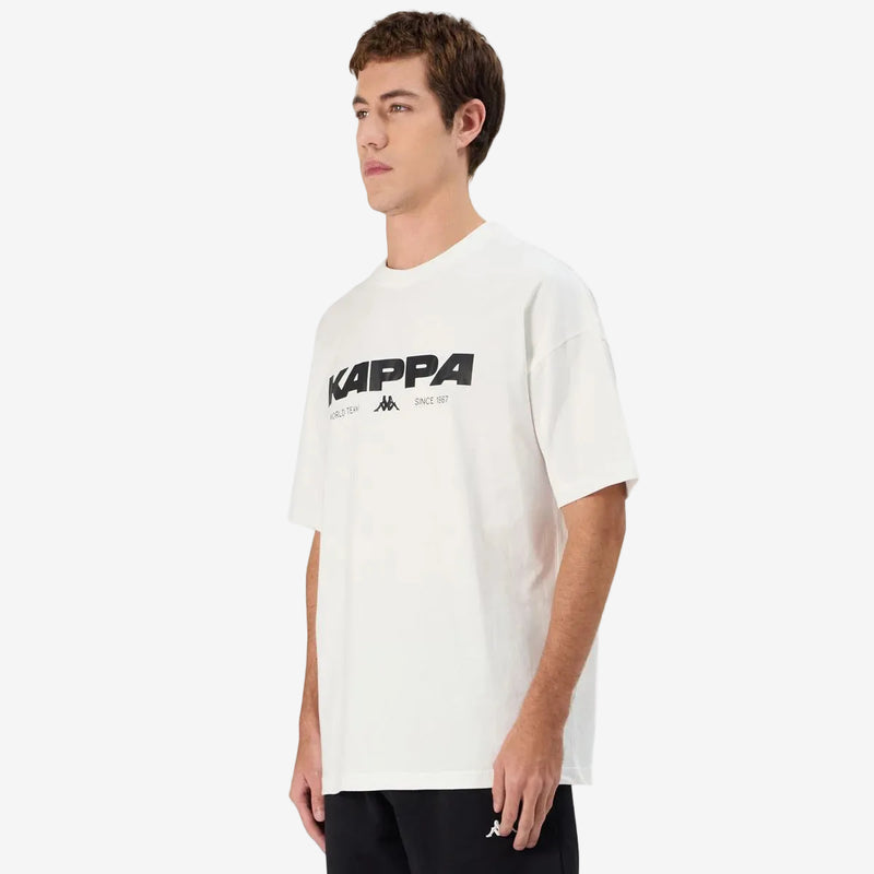 Man wearing Kappa Authentic Nhisso T-Shirt in White. Side view.