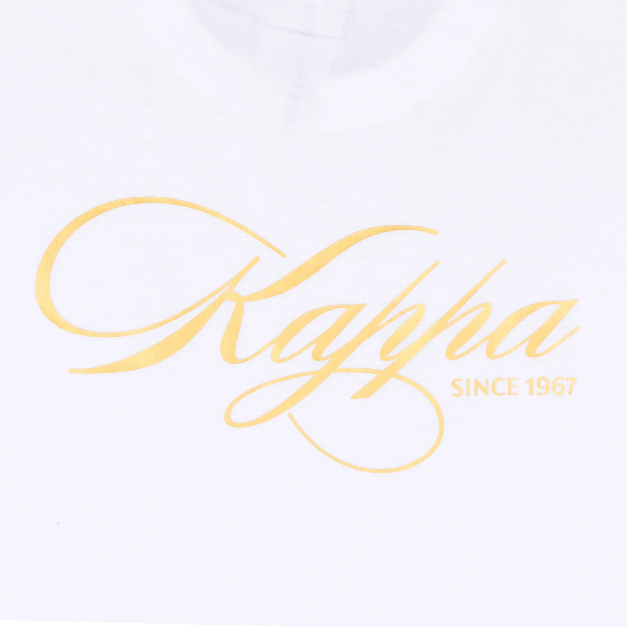 White t-shirt with Kappa lettering in rich gold yellow. Detail view.