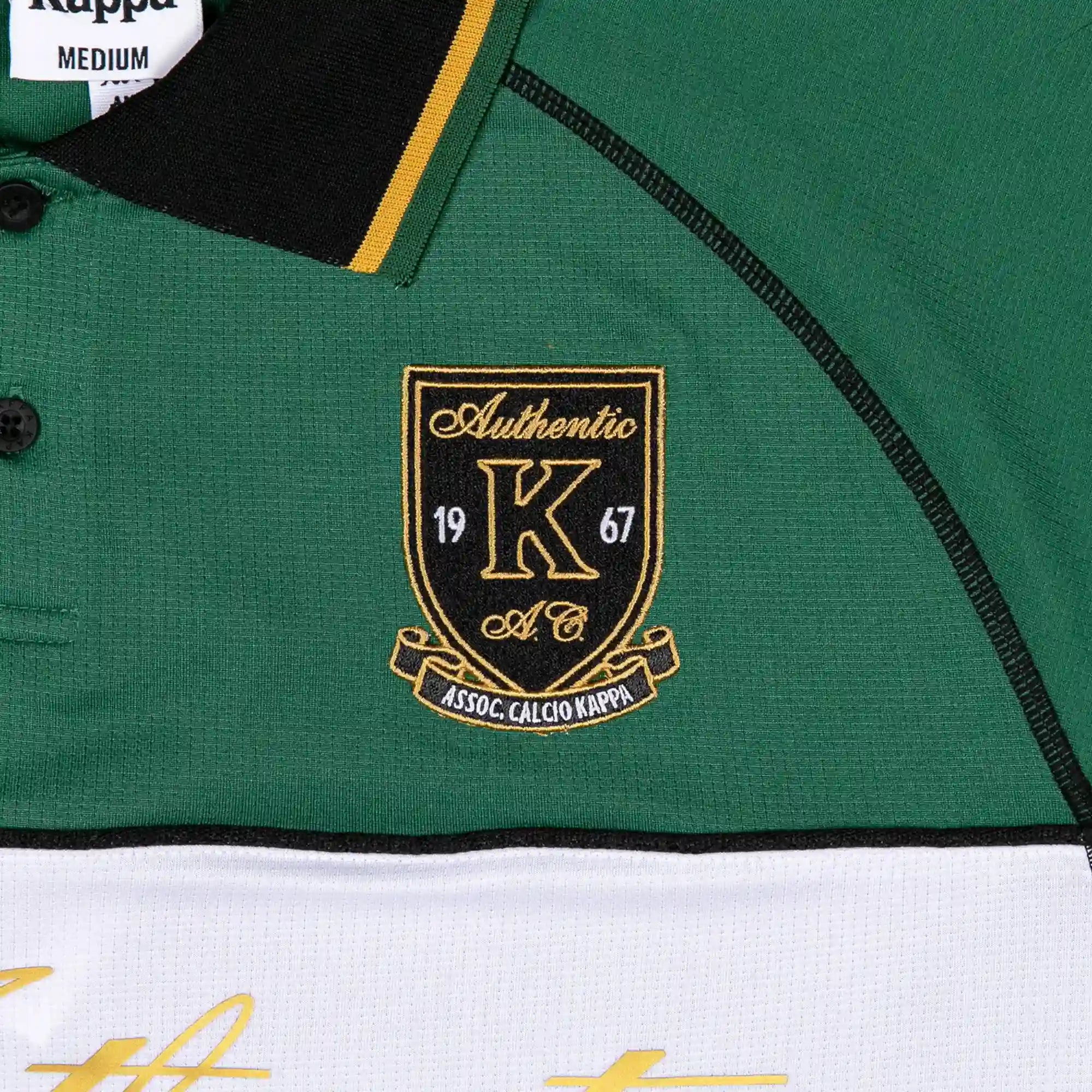 Detail view of Kappa Crest in Black, Gold, and White.