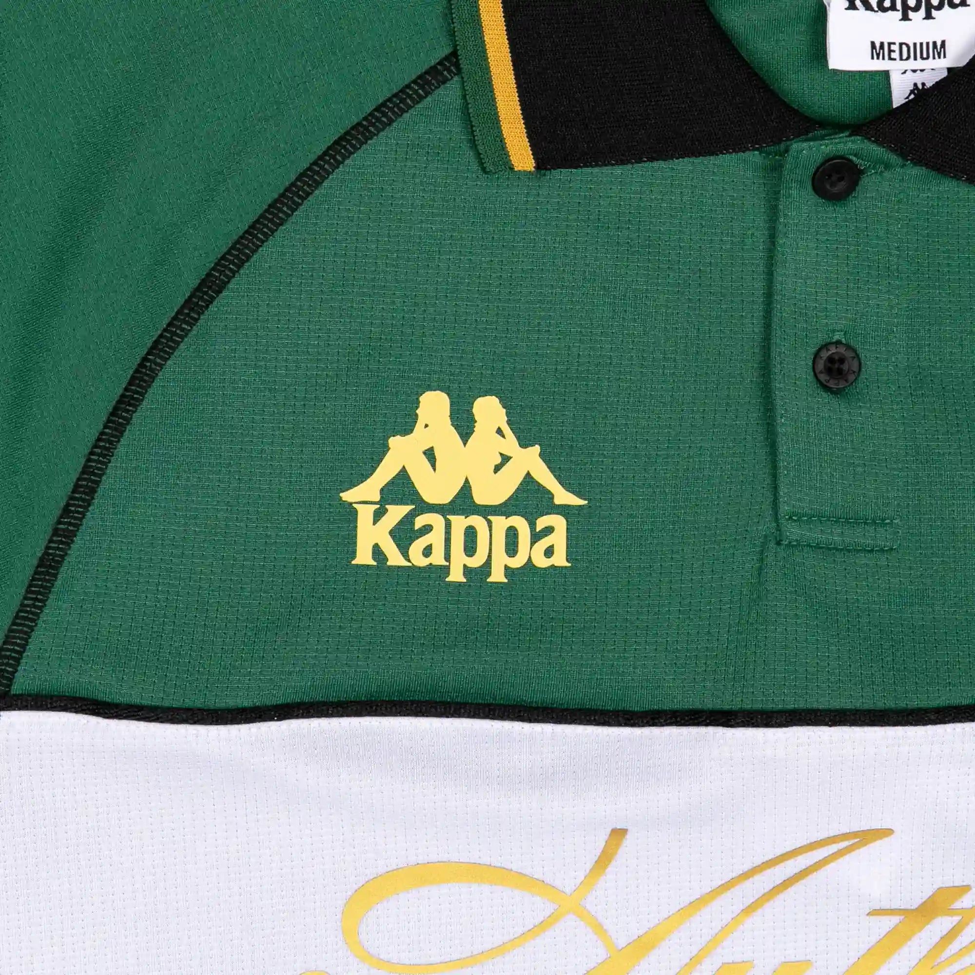 Detail view of gold Kappa logo.