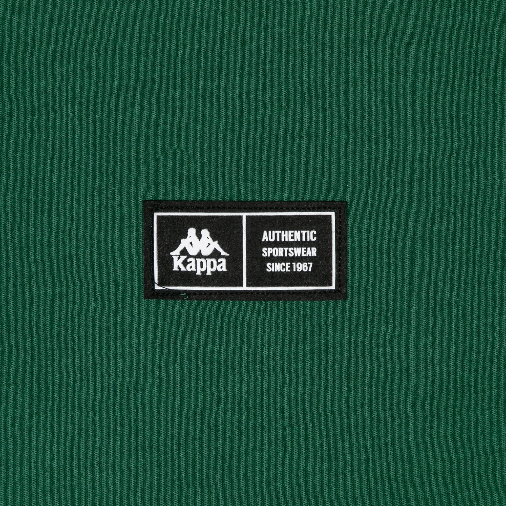 Detail view of silicone patch with Kappa logo and text "Authentic Sportswear Since 1967".