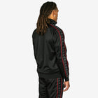 Person wearing a black tracksuit with red accents on a white background