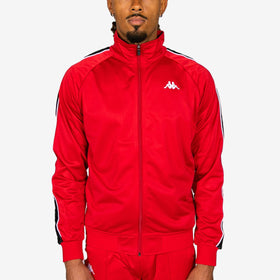 Person wearing a red tracksuit with a brand logo on a white background