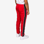 Red track pants with a black stripe on a white background