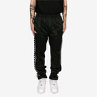 Black track pants with white stripes on a white background