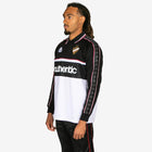 Person wearing a black and white sports jersey with 'Kappa' branding on a white background