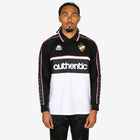Person wearing a black and white sports jersey with 'Kappa' branding on a white background