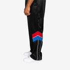 Black track pants with a colorful logo on a white background
