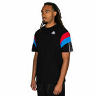 Person wearing a black t-shirt with colorful sleeves on a white background