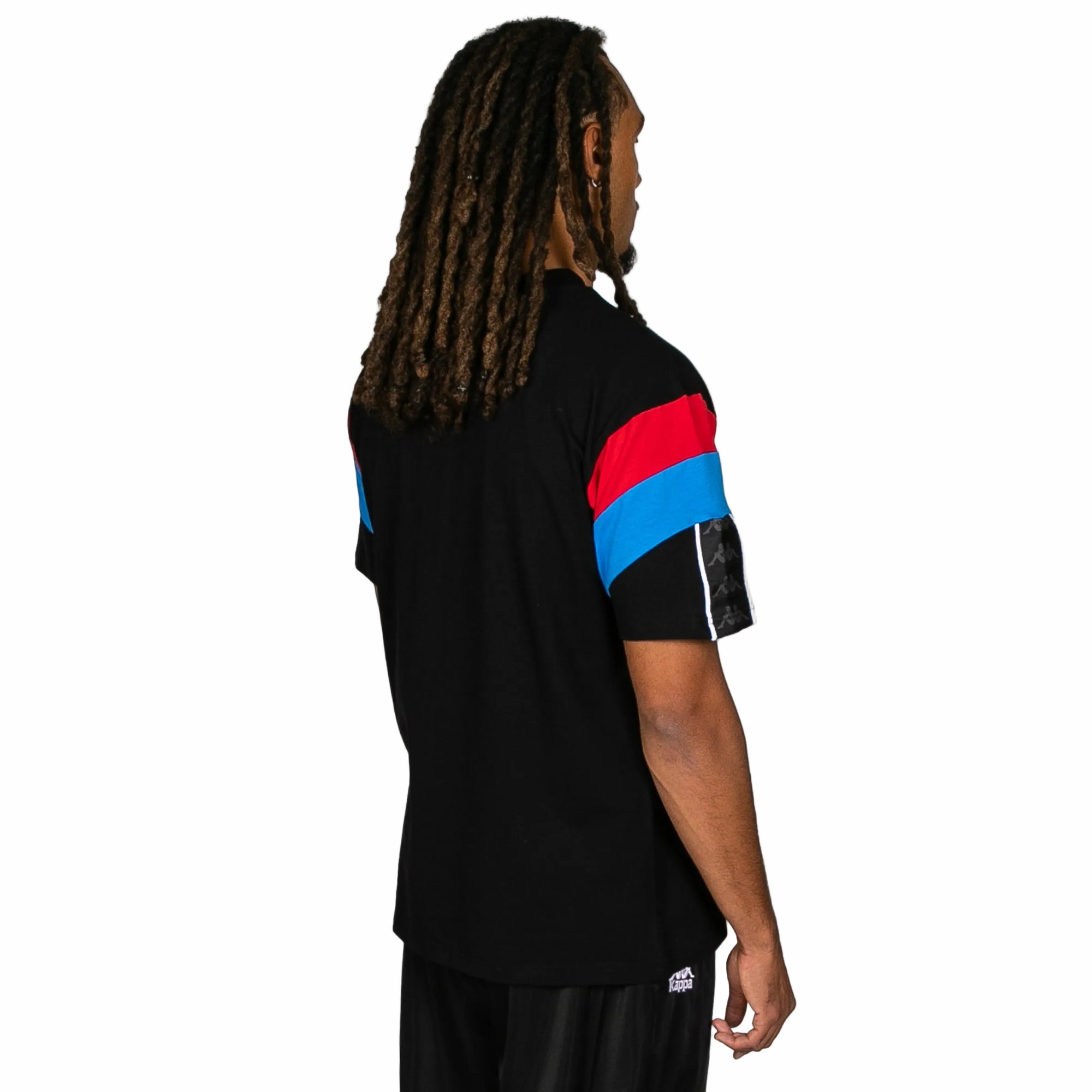 Person wearing a black sports jersey with red and blue stripes on a white background