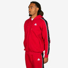 Person wearing a red tracksuit with a logo on a white background