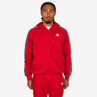 Man wearing a red tracksuit with a logo on a white background