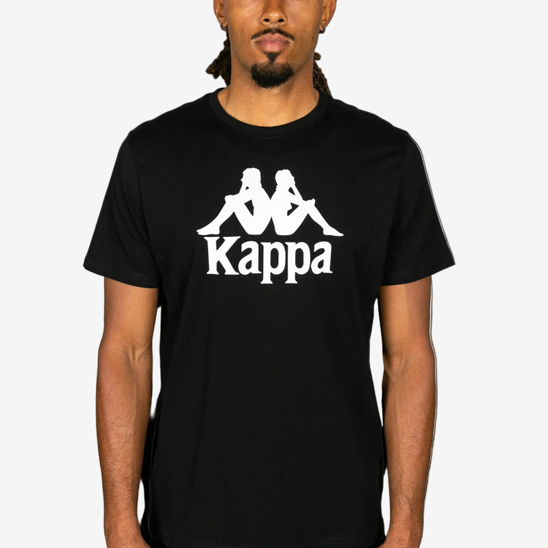 Person wearing a black Kappa t-shirt with white logo