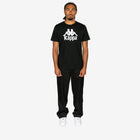 Person wearing a black Kappa t-shirt and pants on a white background