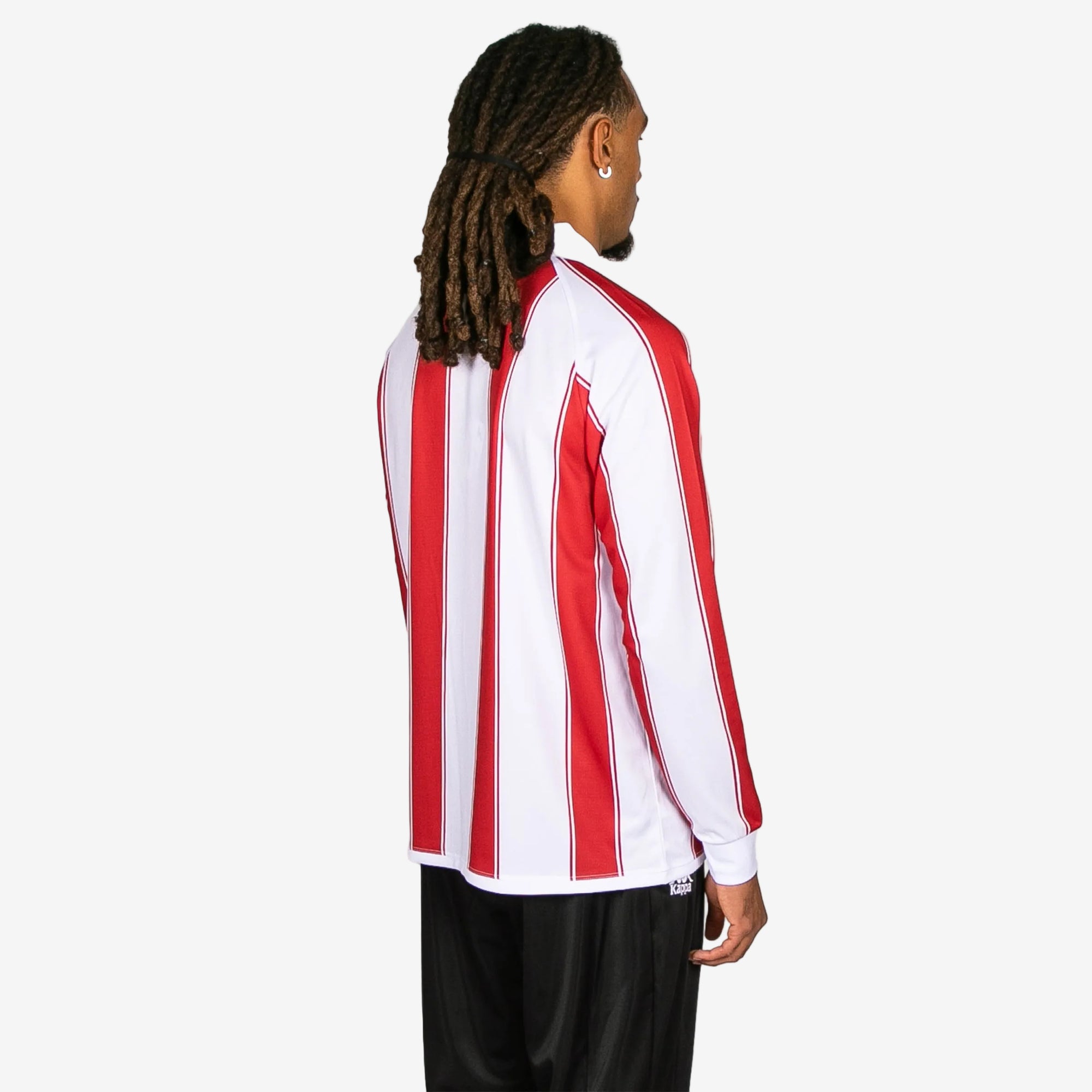 Person wearing a red and white striped long-sleeve shirt on a white background
